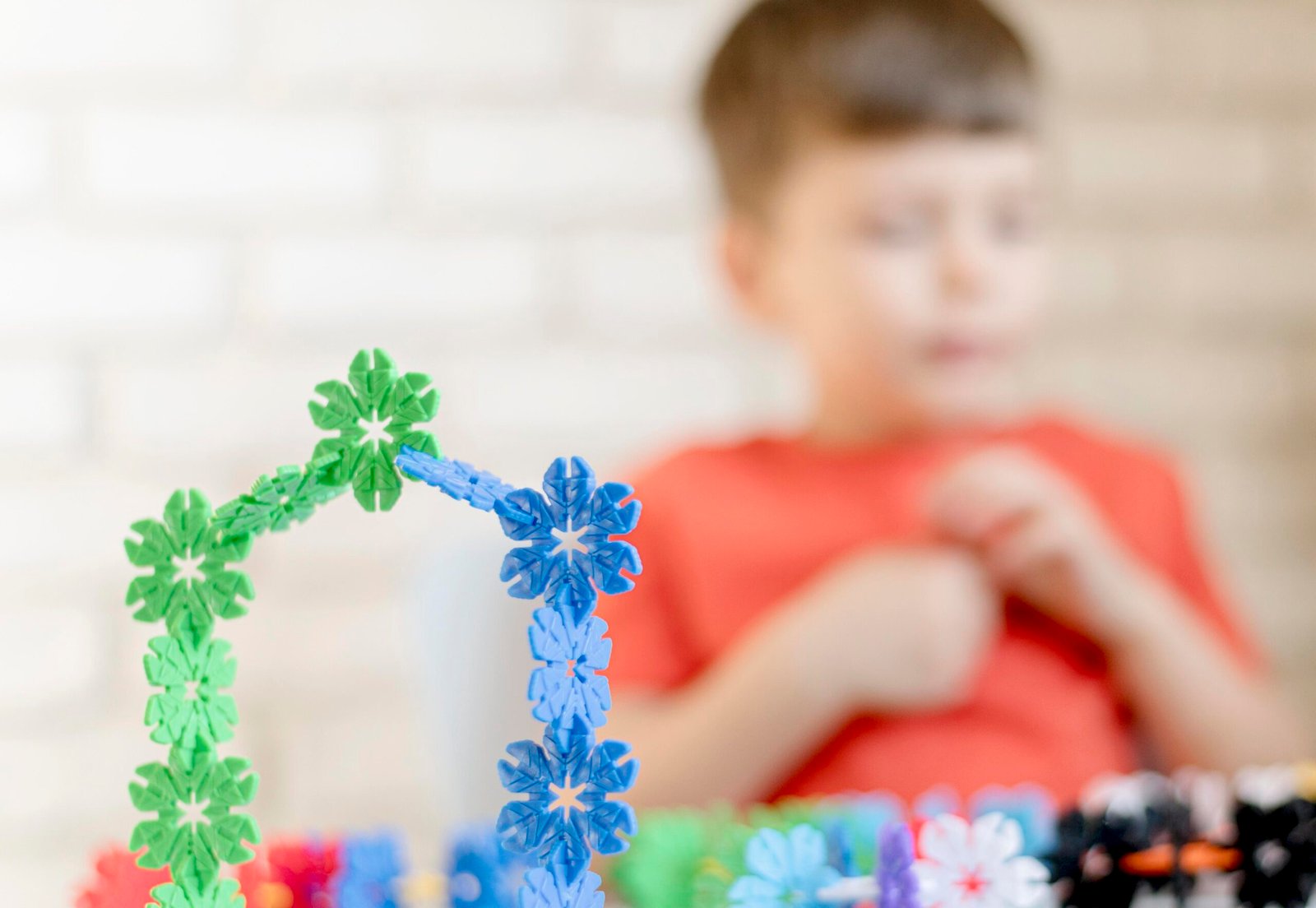 blurred-kid-with-floral-toy